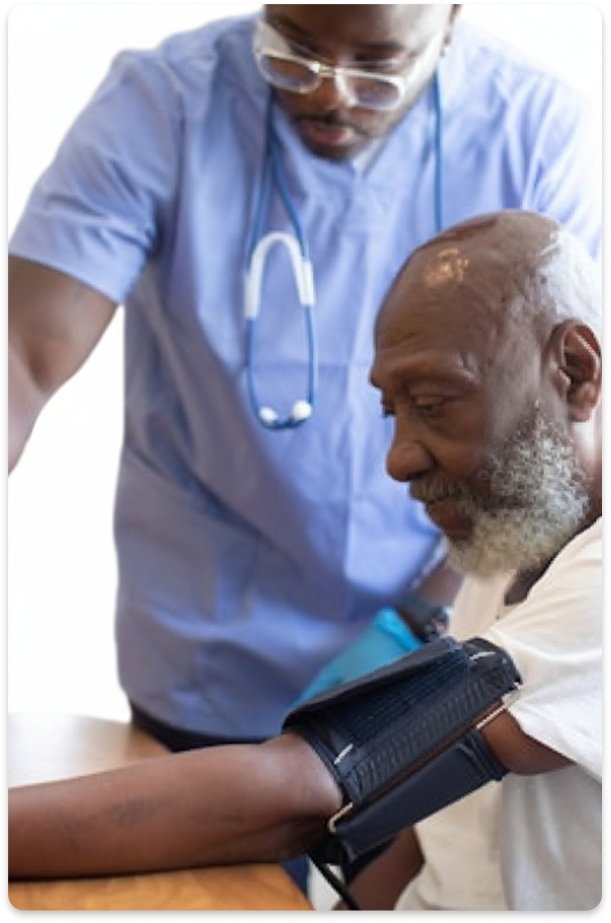 Nurse caring for elderly patient at home